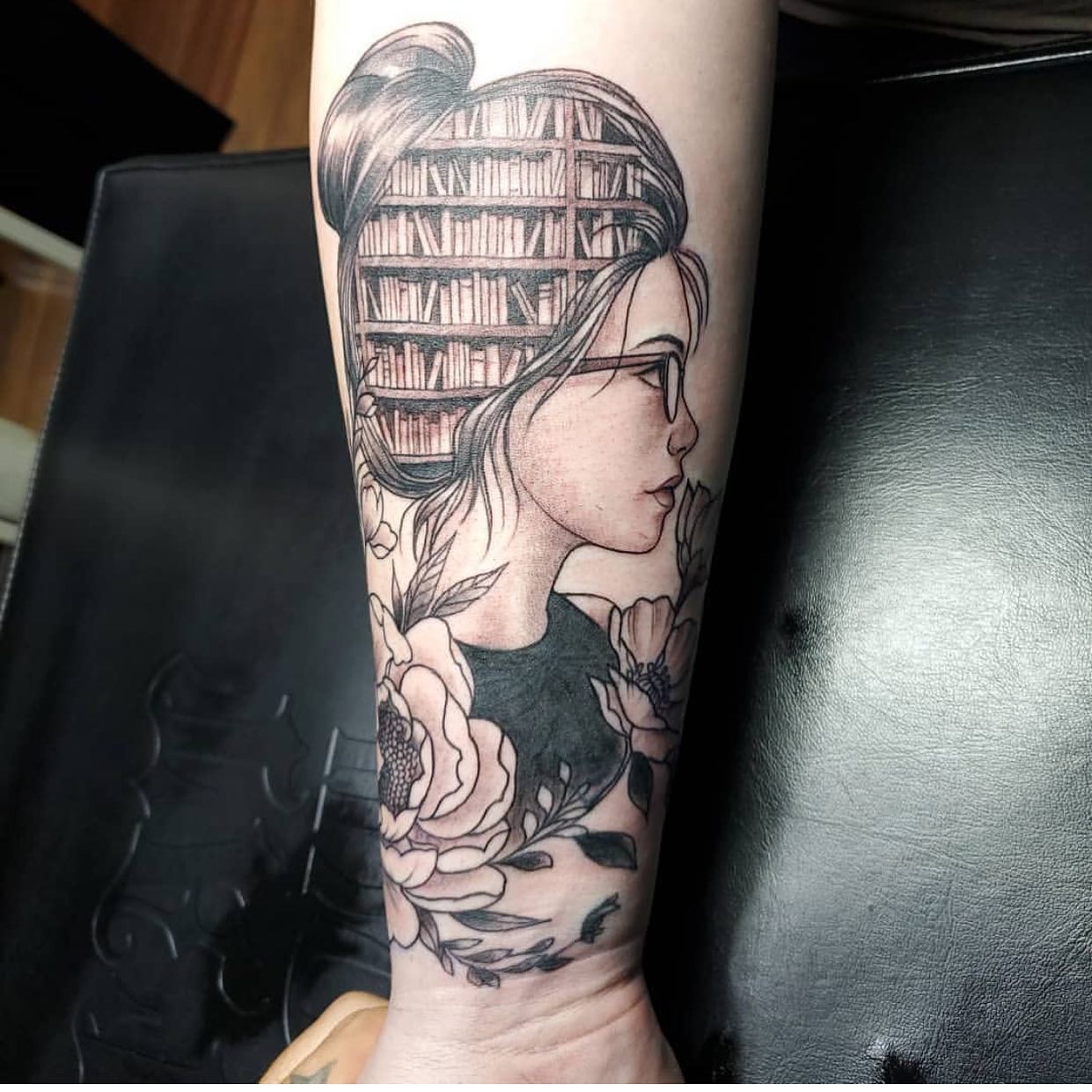 Woman with Library Bun and Floral Frame Tattoo Tattoo Design