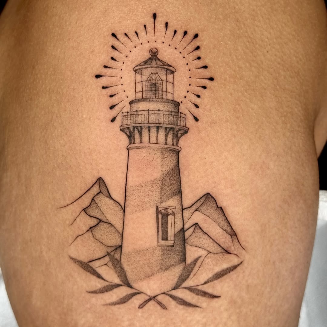 Elegant lighthouse tattoo with mountain elements Tattoo Design