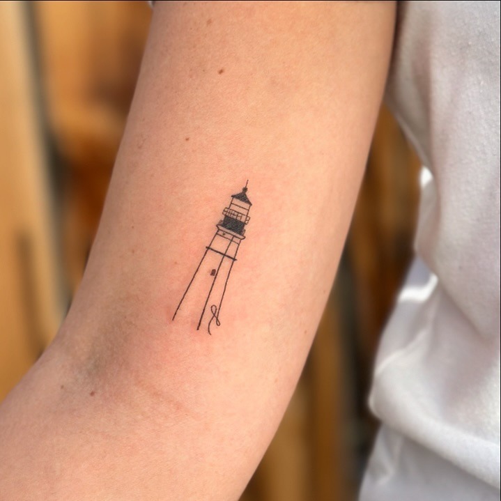 Elegant minimalistic lighthouse tattoo design Tattoo Design