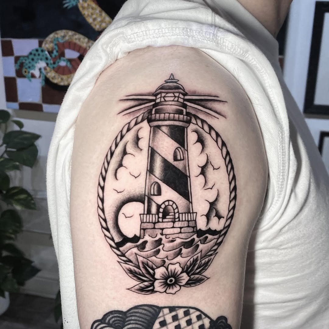 Striking lighthouse tattoo with a nautical vibe Tattoo Design