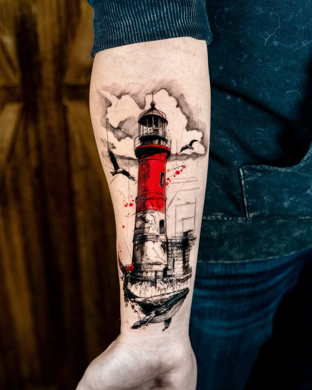 Striking lighthouse tattoo with dramatic colors and details Tattoo Design