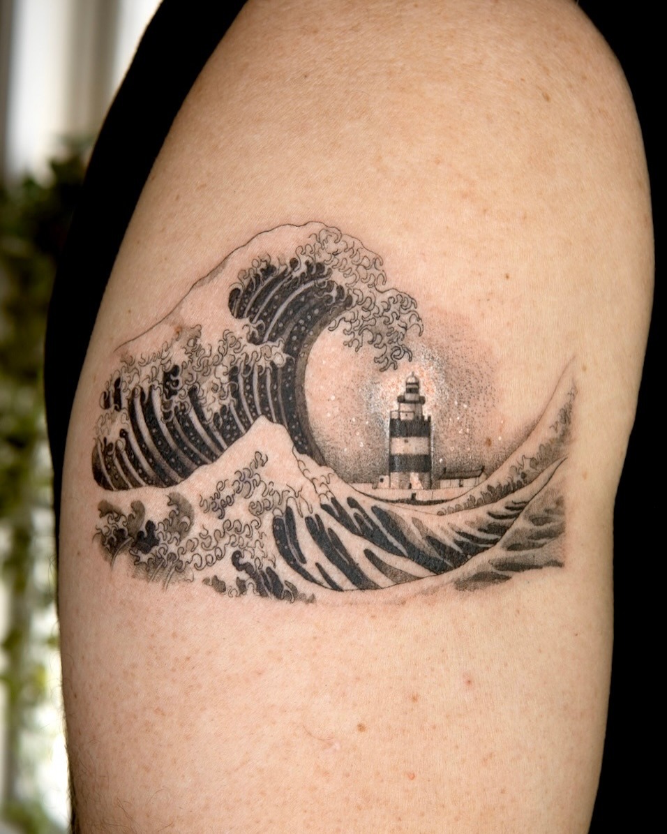 Stunning lighthouse tattoo amidst crashing waves Tattoo Design