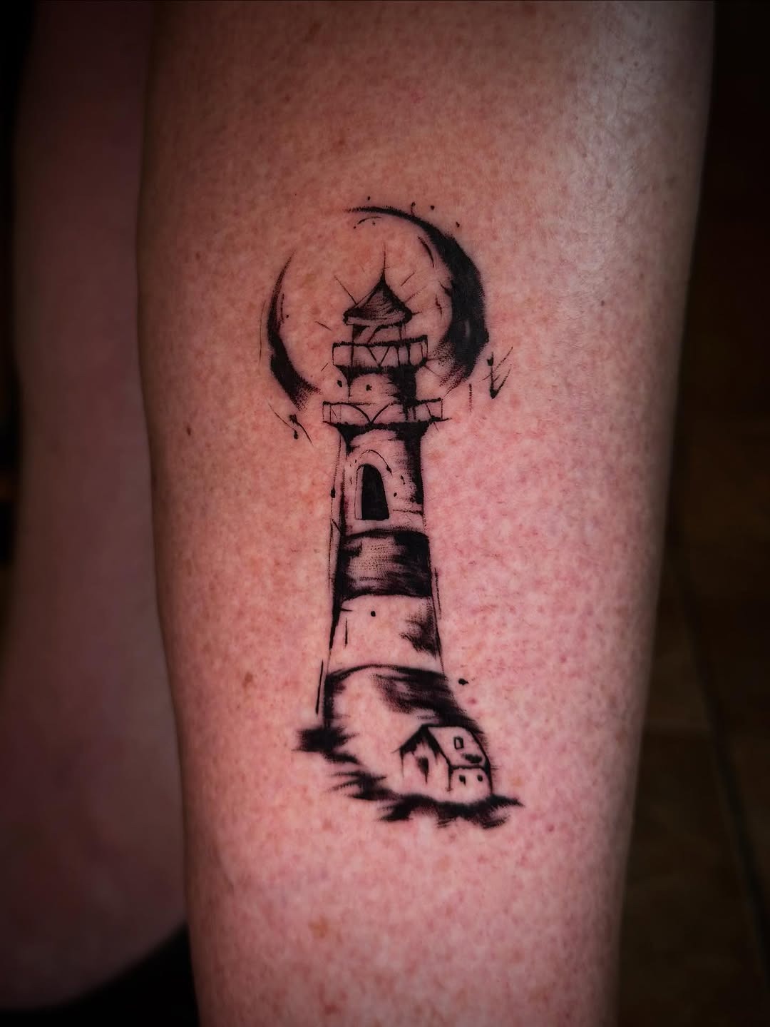 Stunning lighthouse tattoo with bold black ink Tattoo Design
