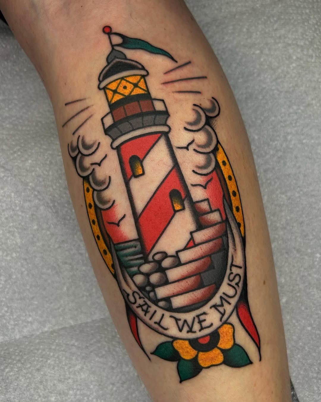 Vibrant lighthouse tattoo with a motivational message Tattoo Design