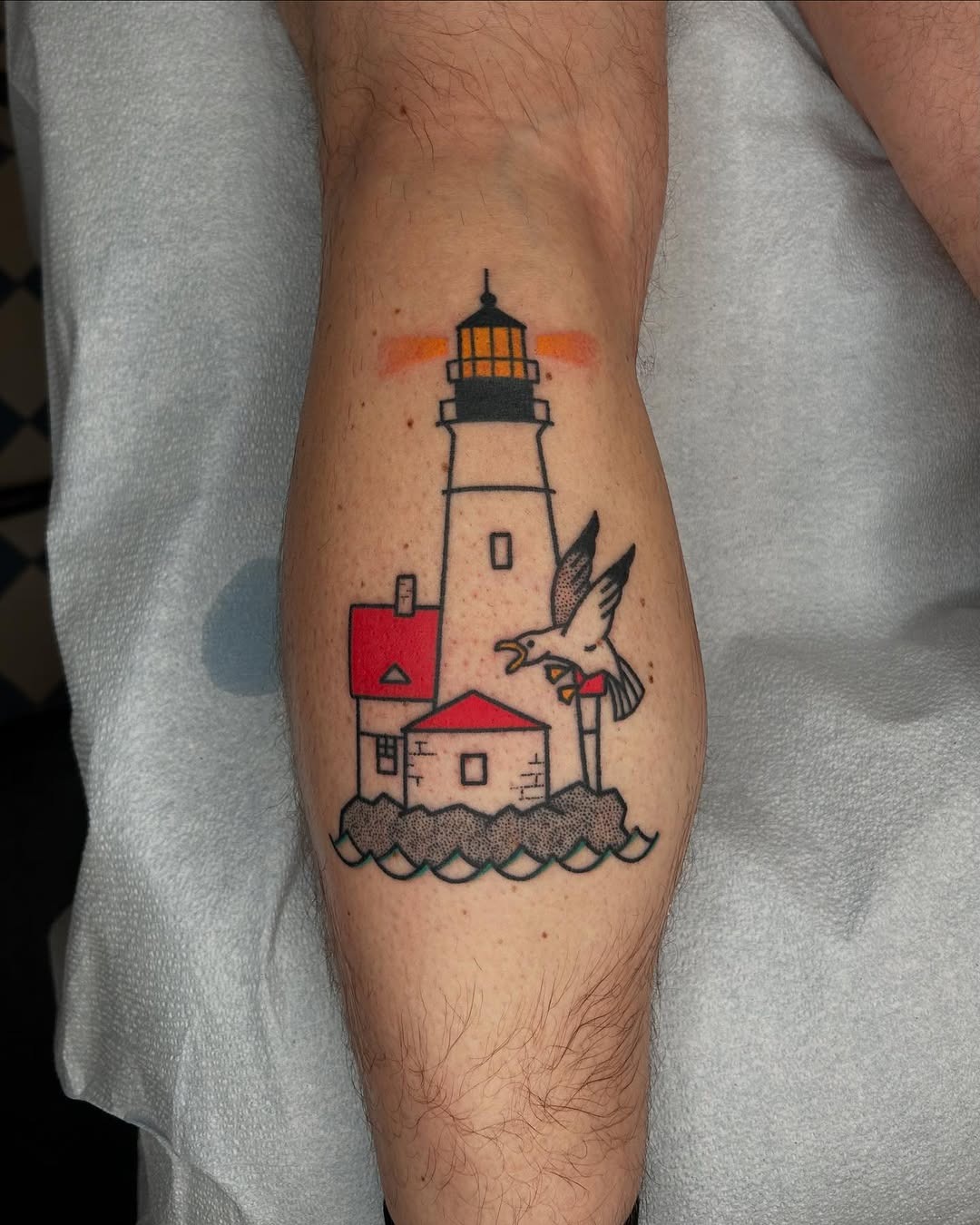 Vibrant lighthouse tattoo with a seagull motif Tattoo Design