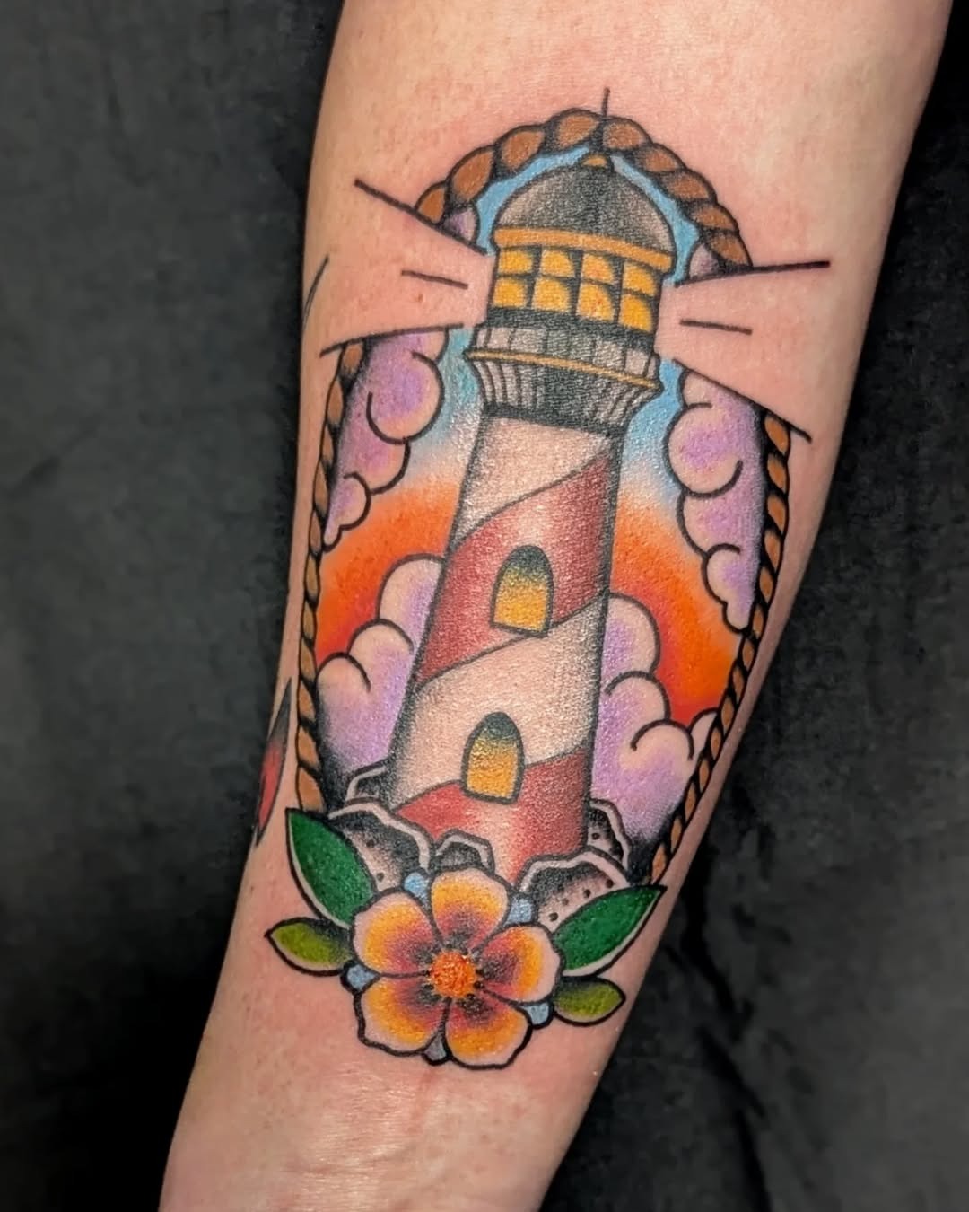 Vibrant lighthouse tattoo with floral accents Tattoo Design