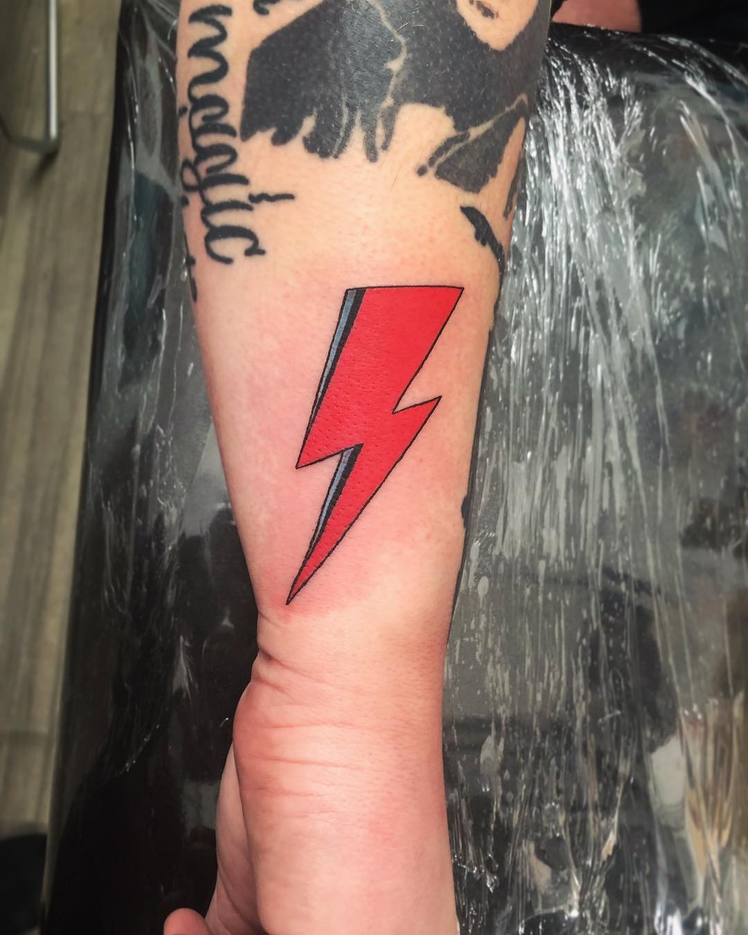 Bold lightning bolt tattoo in striking colors Tattoo Design
