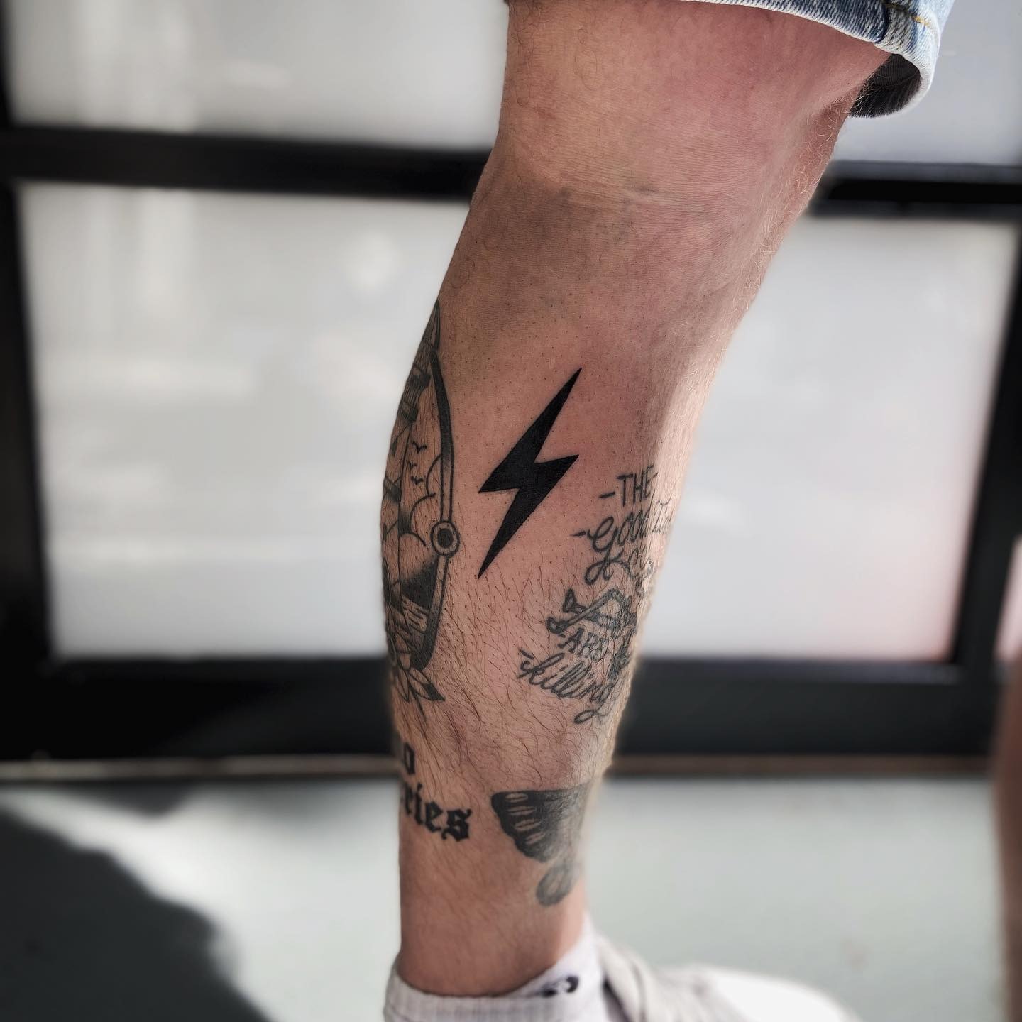 Bold lightning bolt tattoo on leg Tattoo Design