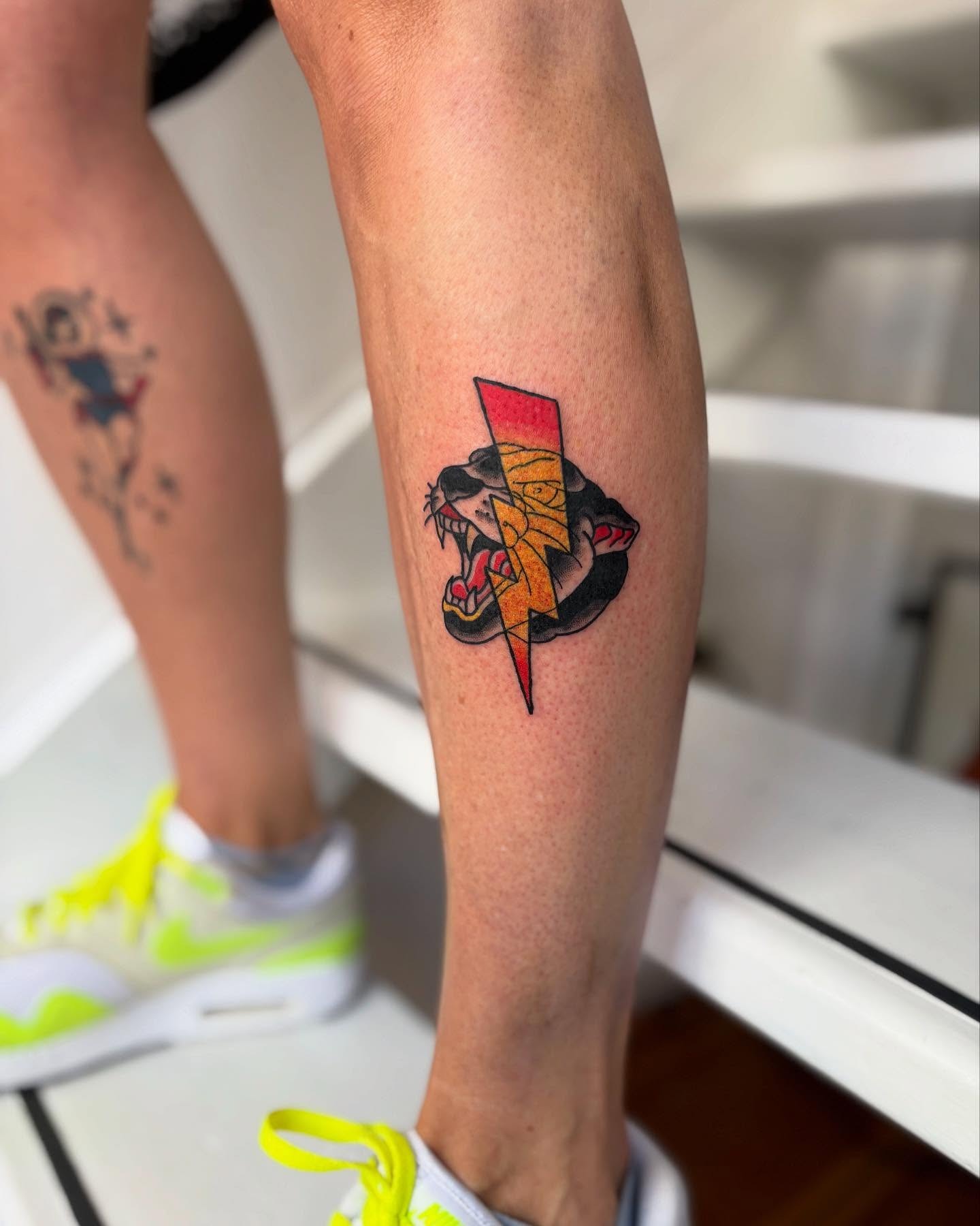 Bold lightning bolt with fierce lion tattoo Tattoo Design