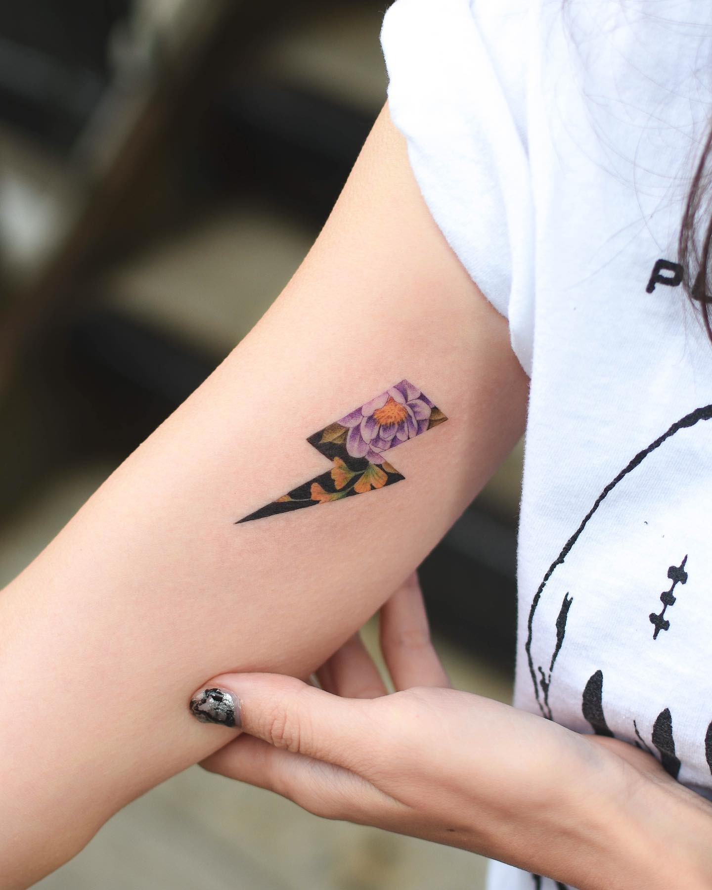 Colorful lightning bolt with floral theme Tattoo Design