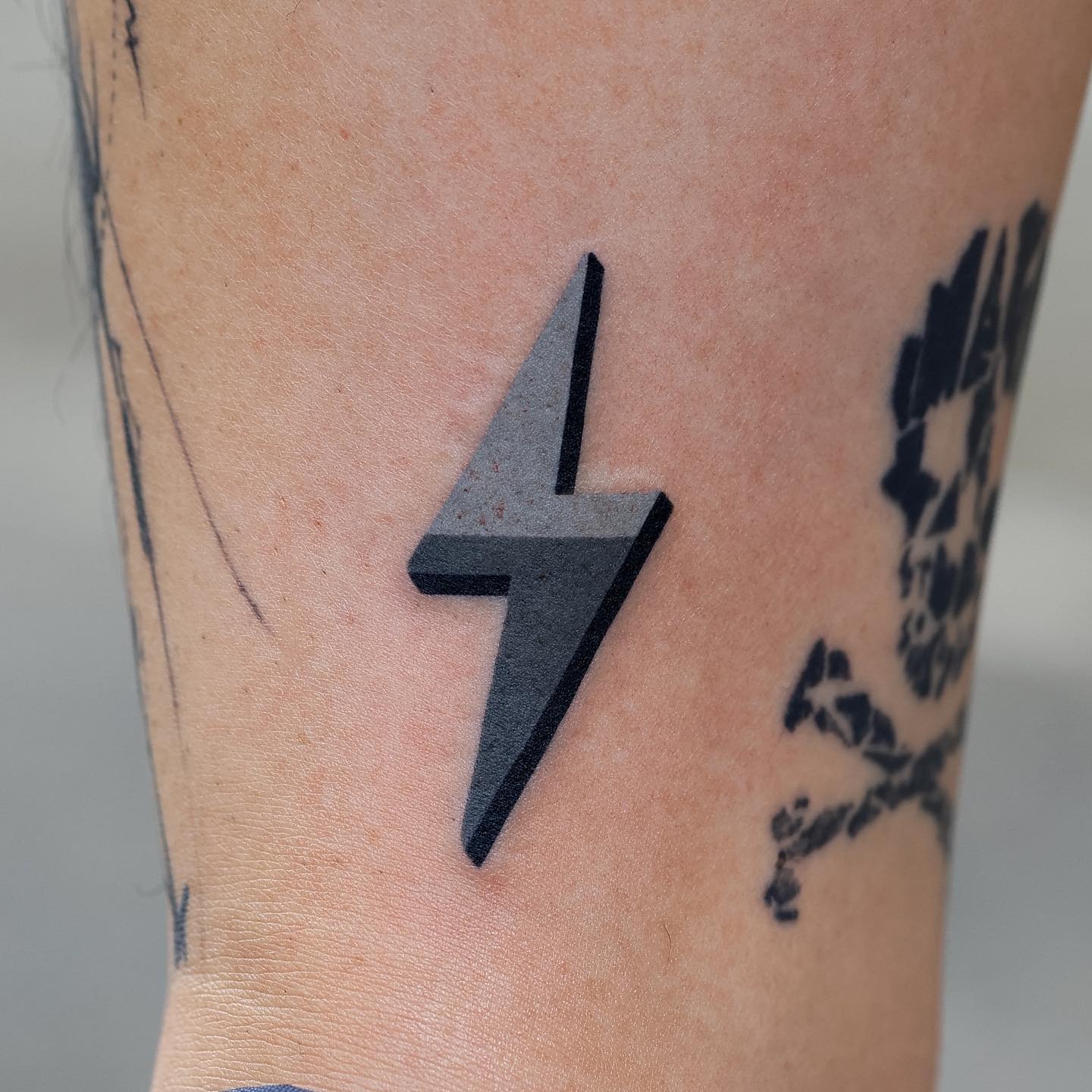 Minimalist lightning bolt tattoo in sleek design Tattoo Design
