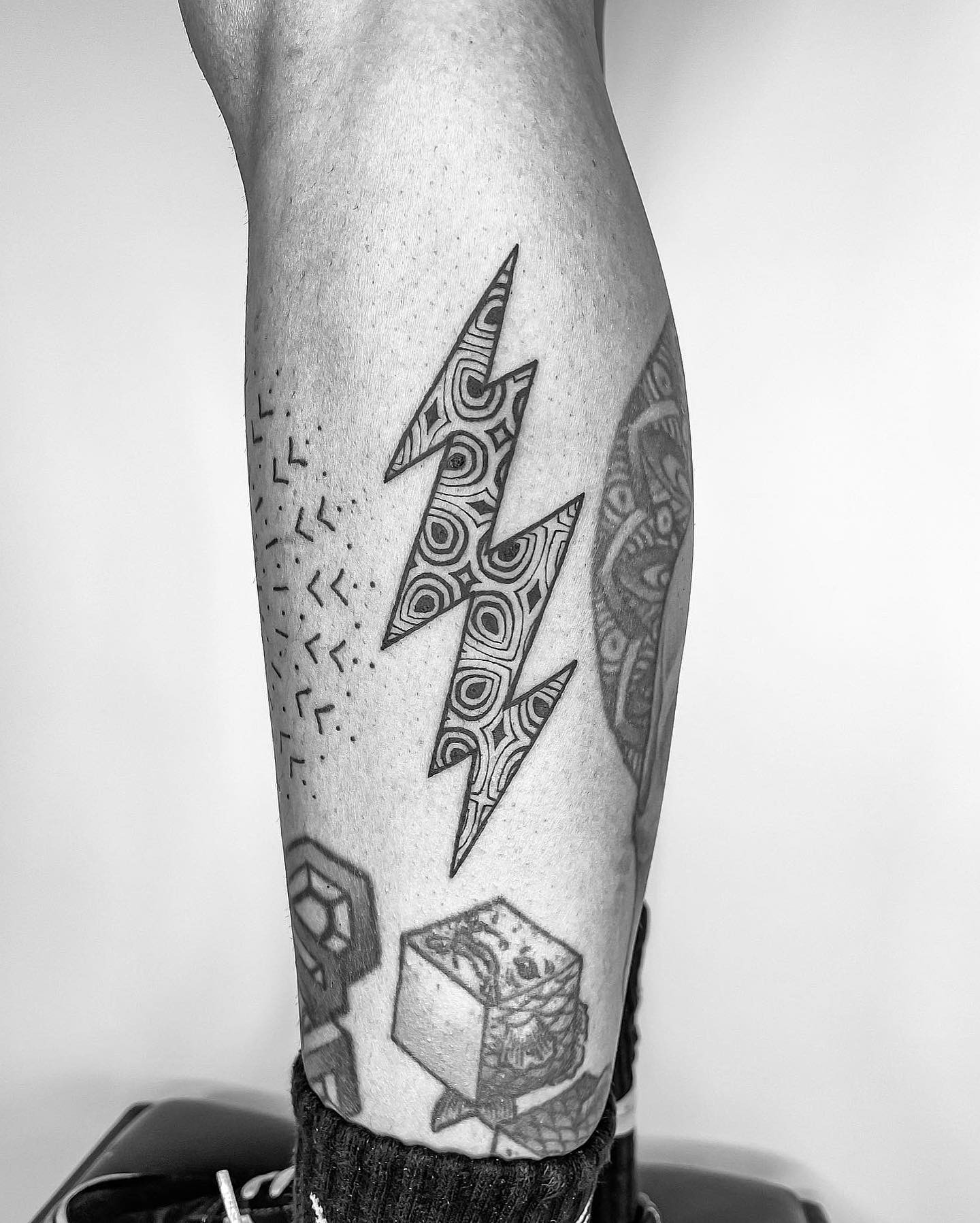 Striking geometric lightning bolt tattoo design Tattoo Design