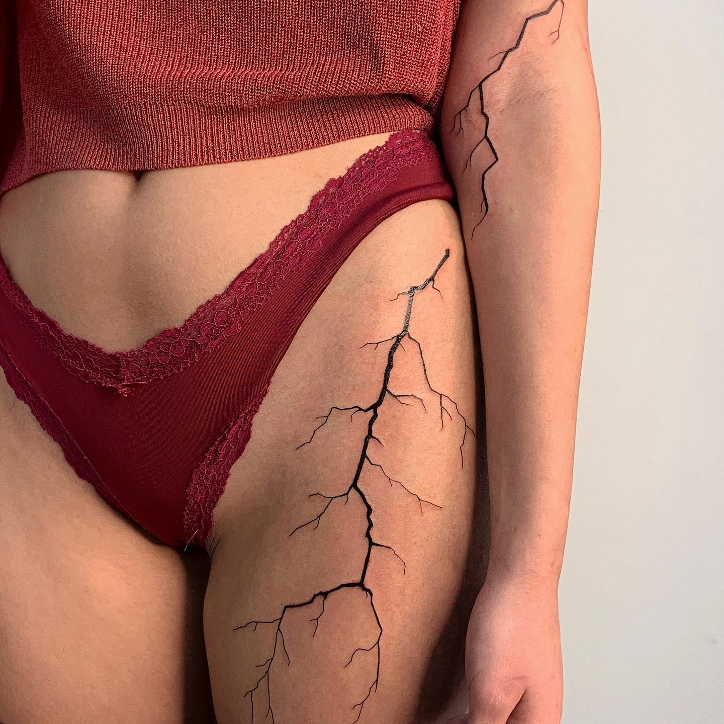 Striking lightning bolt tattoo design on skin Tattoo Design