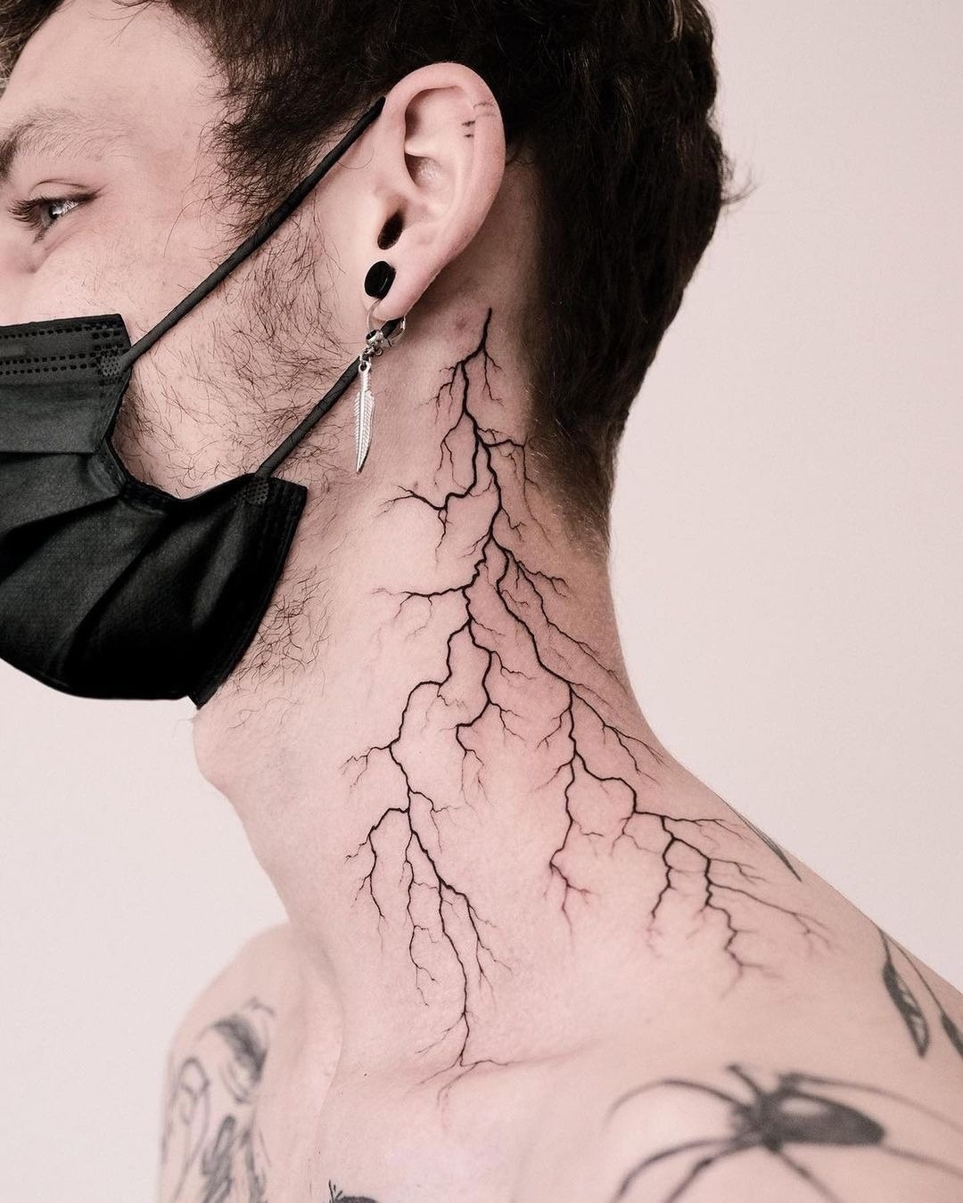 Striking lightning bolt tattoo on neck Tattoo Design
