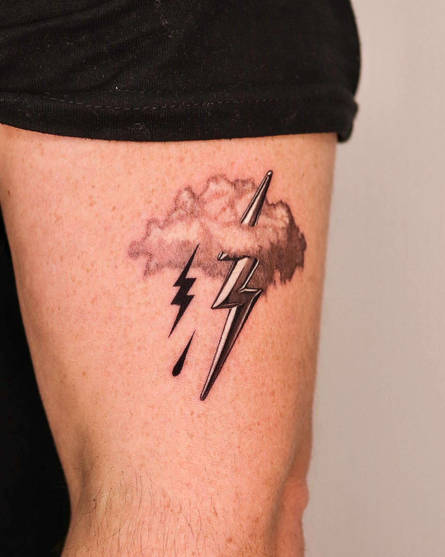Striking lightning bolt tattoo with cloud design Tattoo Design
