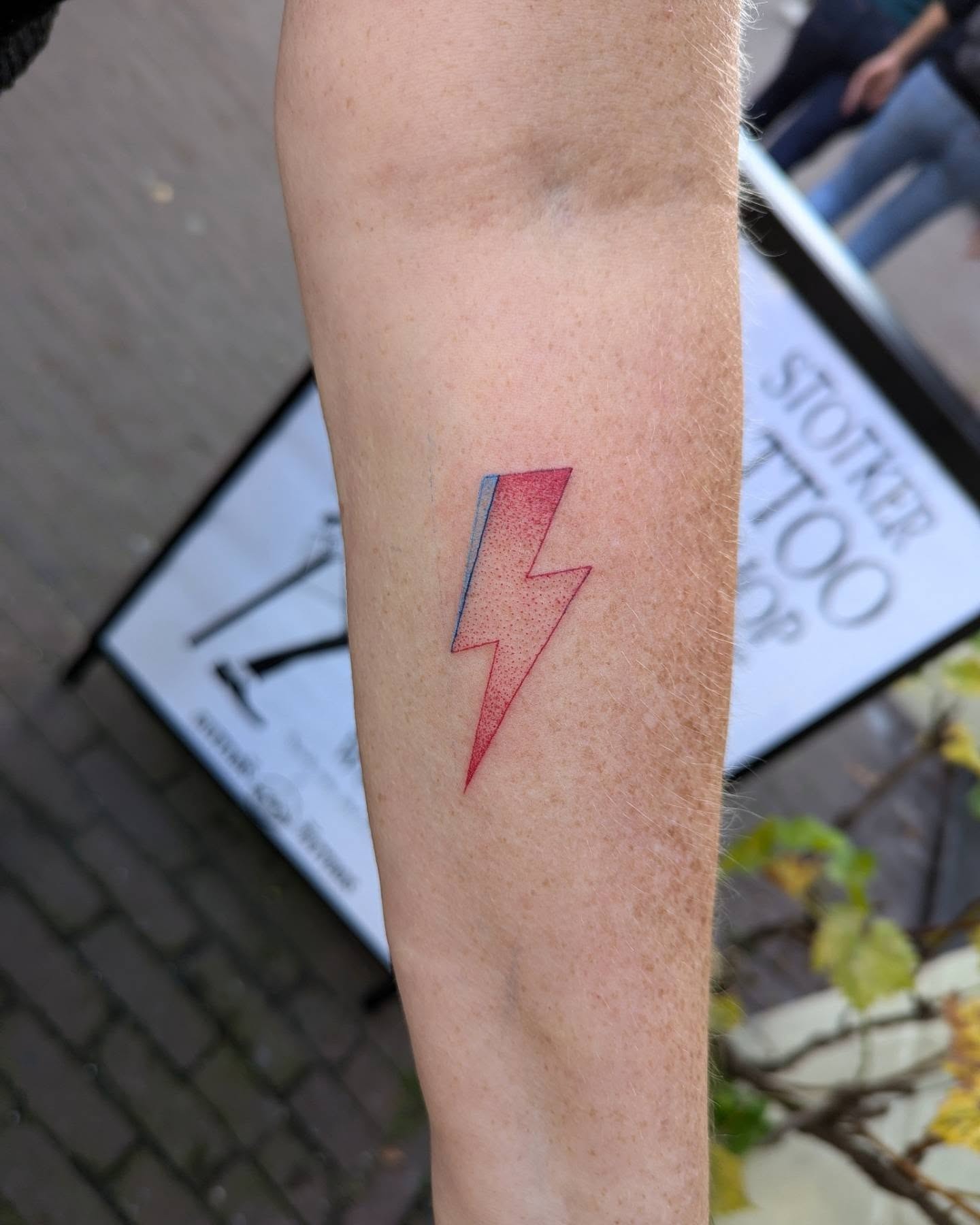 Stunning lightning bolt tattoo in red hues Tattoo Design