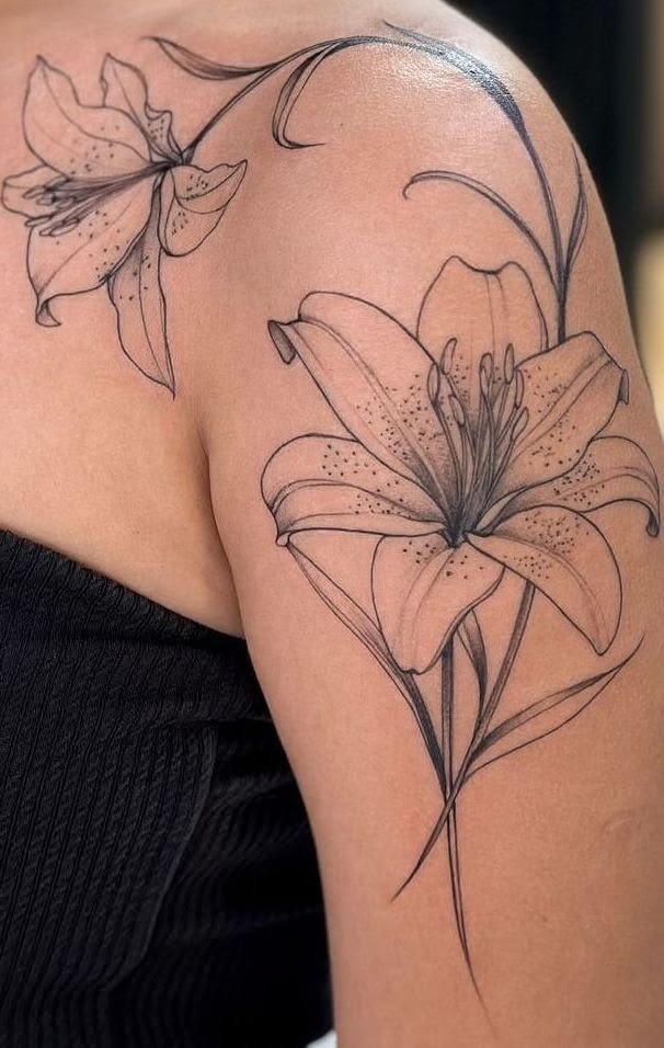 Elegant Lily Linework Tattoo, a tattoo design rendered in sketch-style for the shoulder.