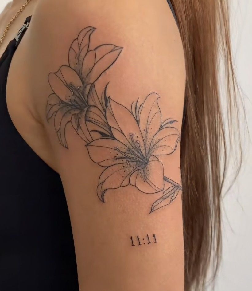 Lily with Lucky Number Tattoo, a tattoo design rendered in clean detailed linework for the upper arm.