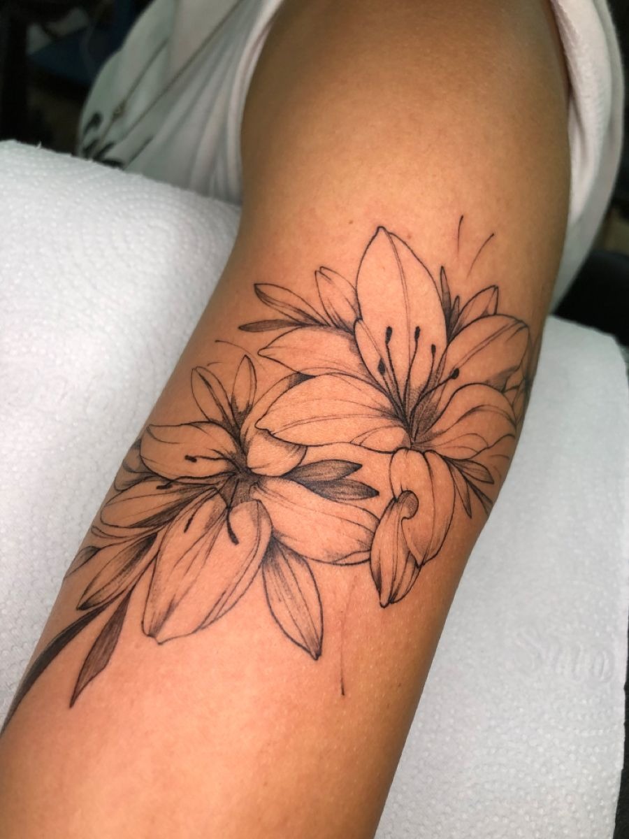 Soft Shaded Lily Bloom Tattoo, a tattoo design rendered in clean detailed linework for the arm.