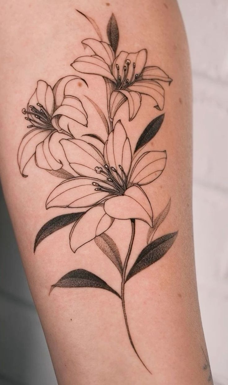 Tall Lily Trio Tattoo, a tattoo design rendered in clean detailed linework.