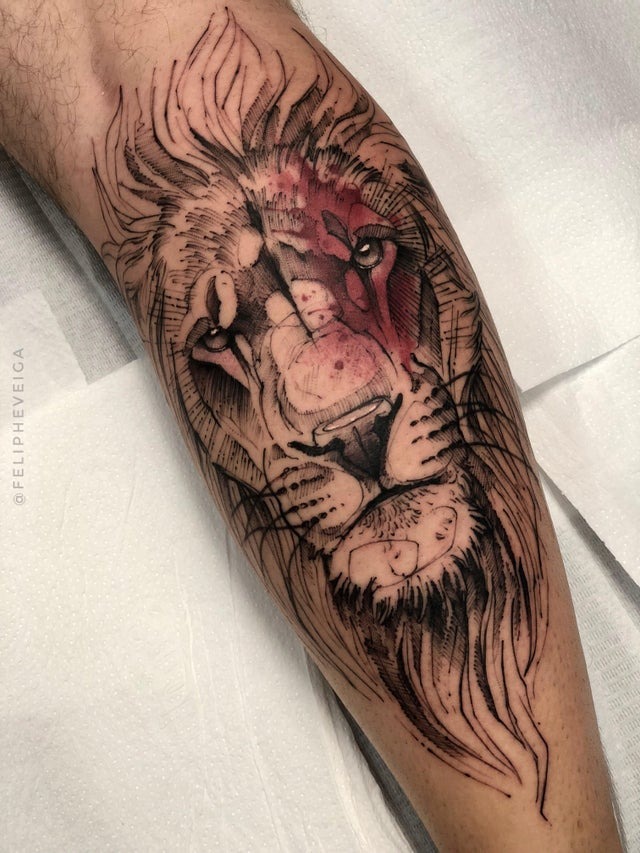 Lion Tattoo Ideas: Blue Eyed Lion Head Tattoo on Hand Tattoo Design