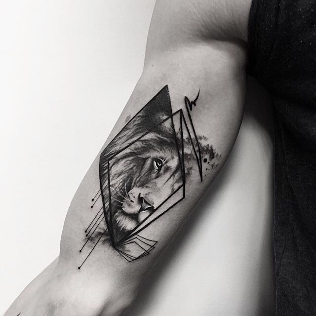 Lion Tattoo Ideas: Lifelike Lion Face in Triangle Tattoo Tattoo Design