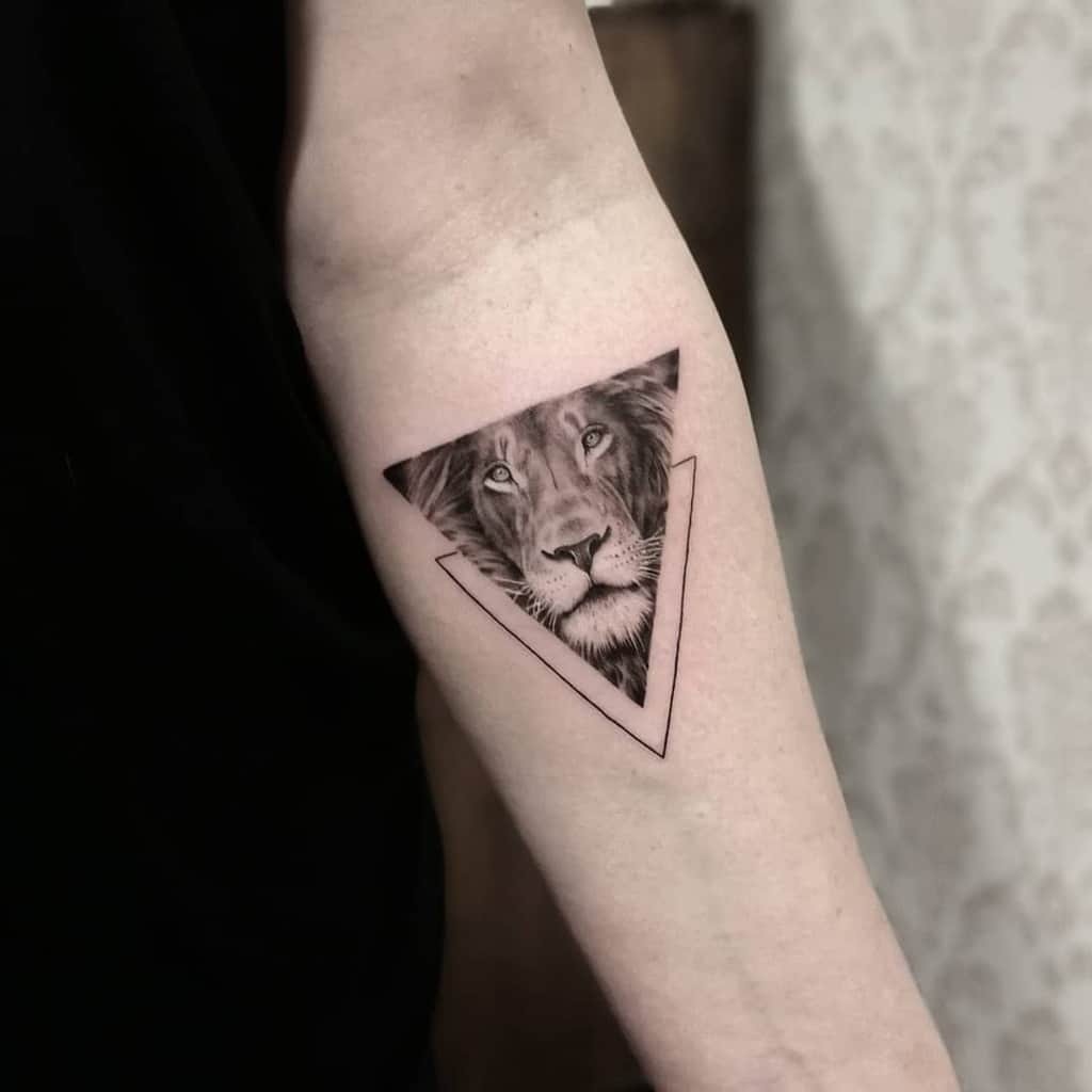 Lion Tattoo Ideas: Roaring Lion Tattoo with Crown Arm Tattoo Design