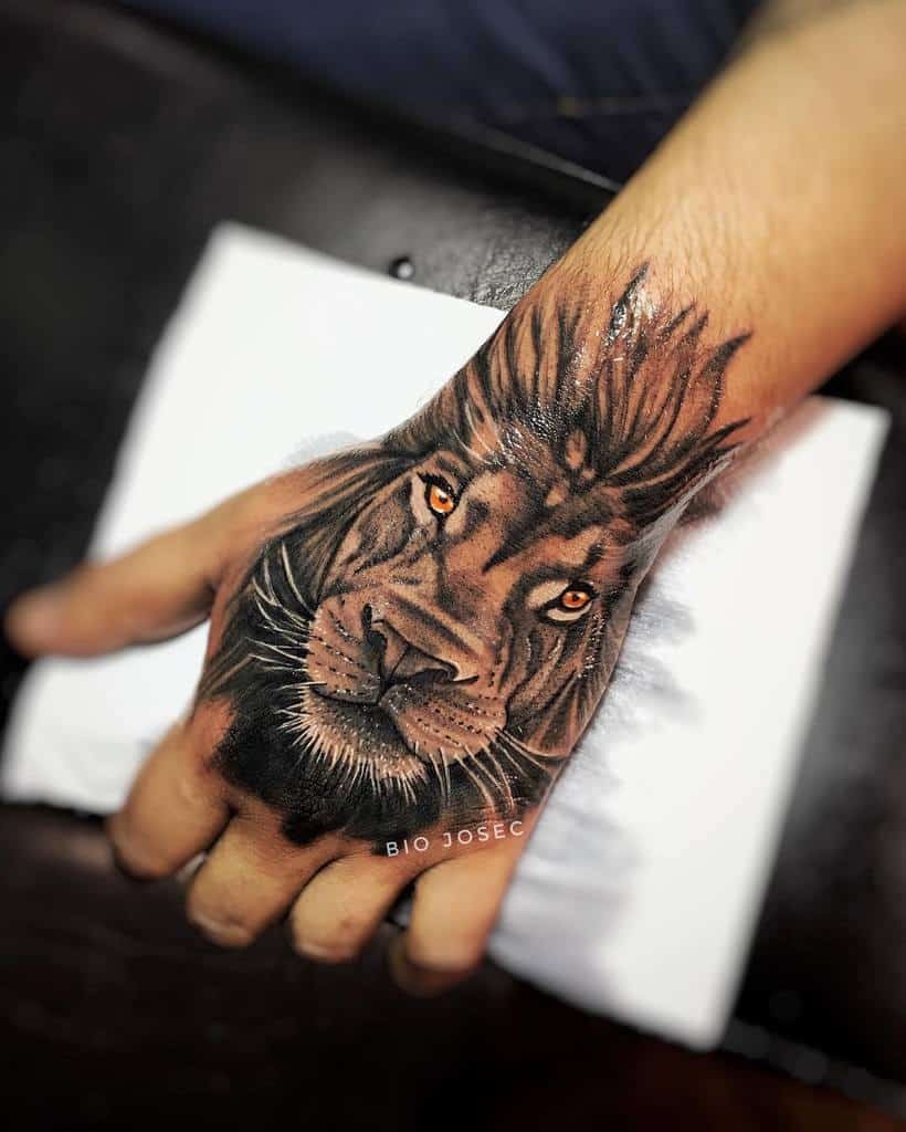 Warrior with Lion Headdress Tattoo on Leg Tattoo Design