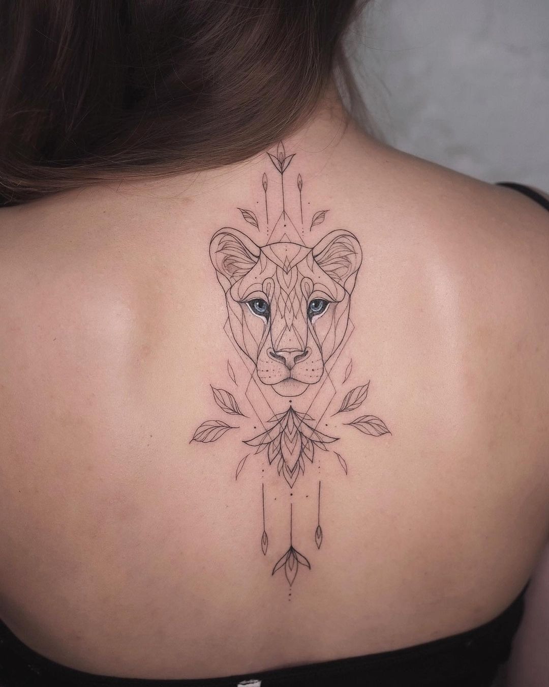 Geometric Blue-Eyed Lioness Back Ornament Tattoo Design