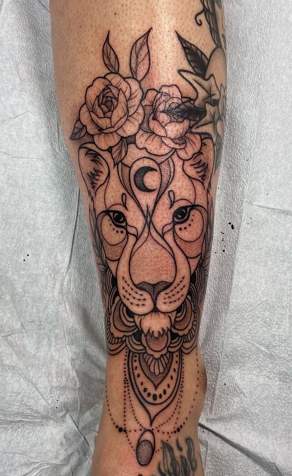 Lunar-Mandala Lioness with Rosettes Tattoo Design