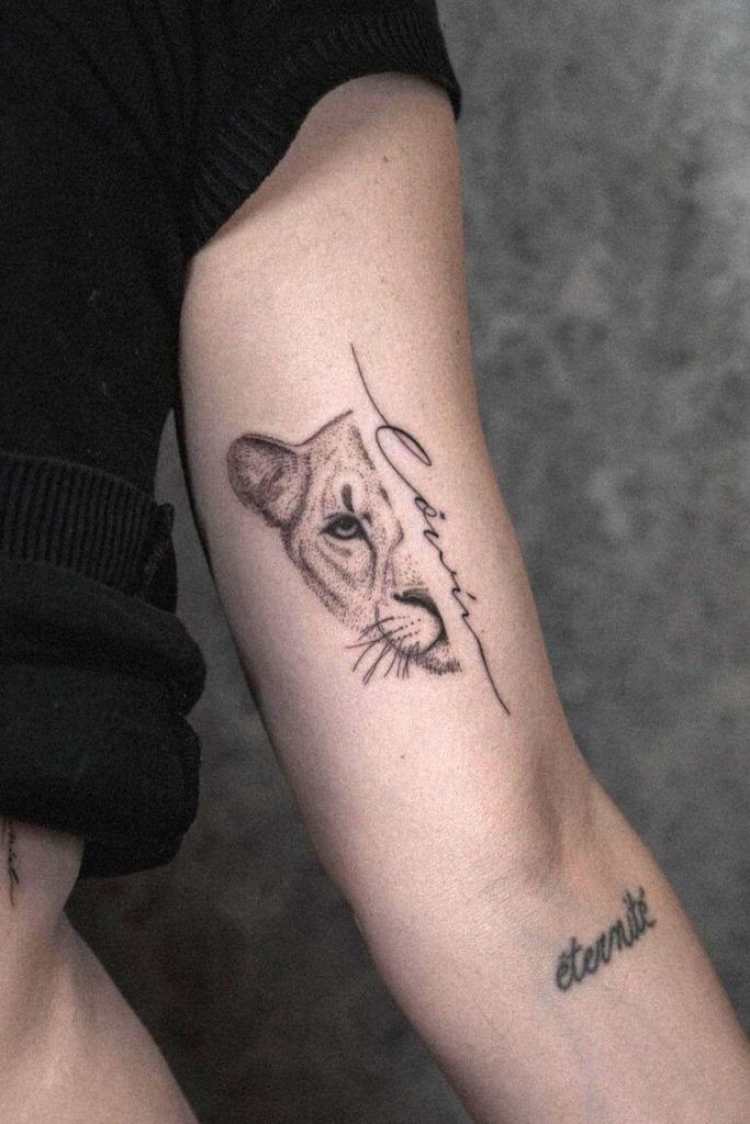 Script-Kissed Half Lioness Bicep Piece Tattoo Design