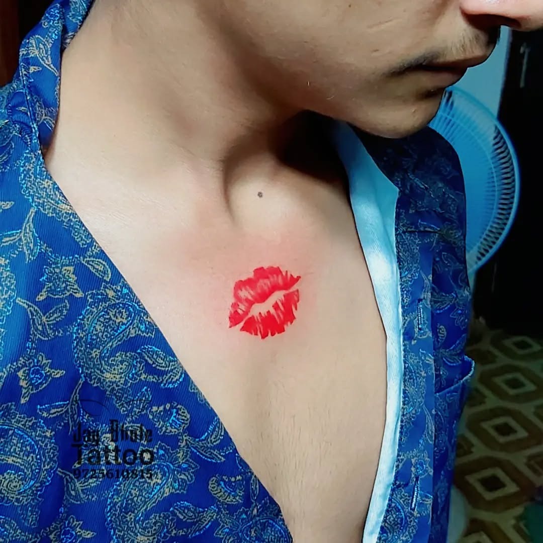 Bold kiss mark tattoo on chest Tattoo Design