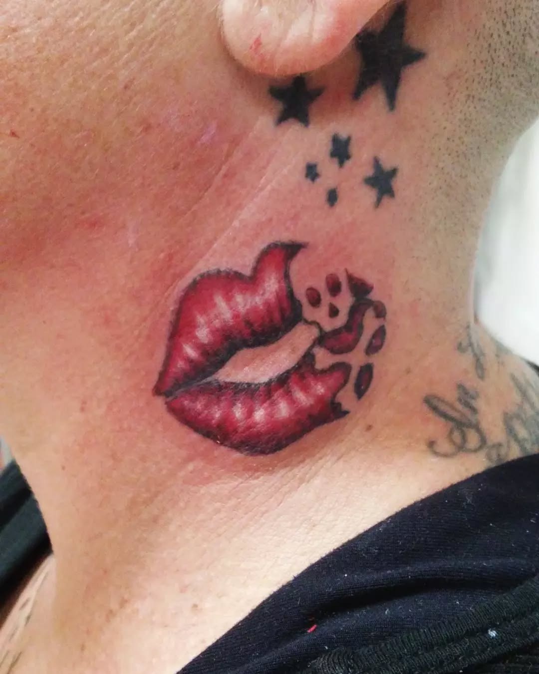 Bold lip tattoo with star accents Tattoo Design