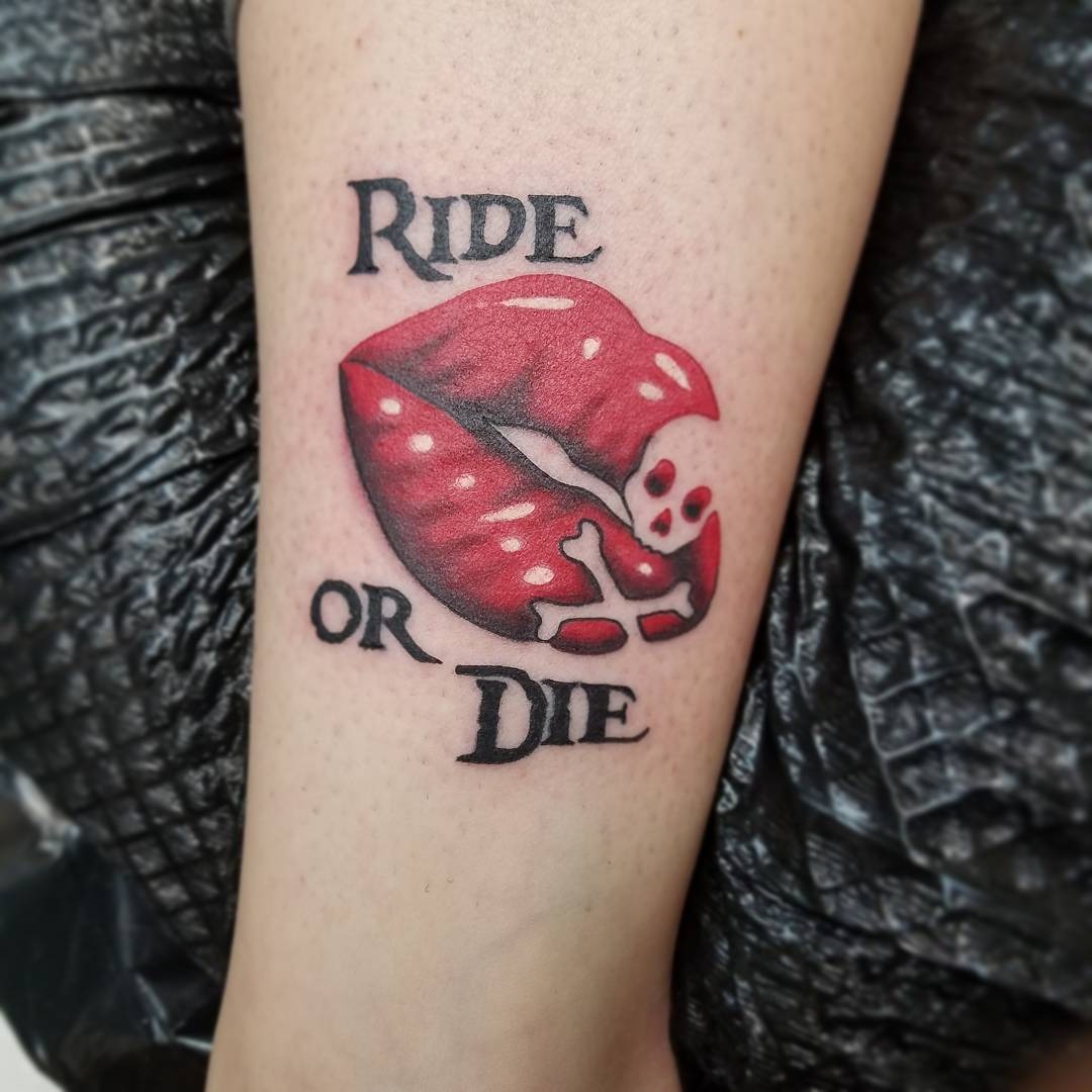 Bold lips tattoo with a fierce mantra Tattoo Design