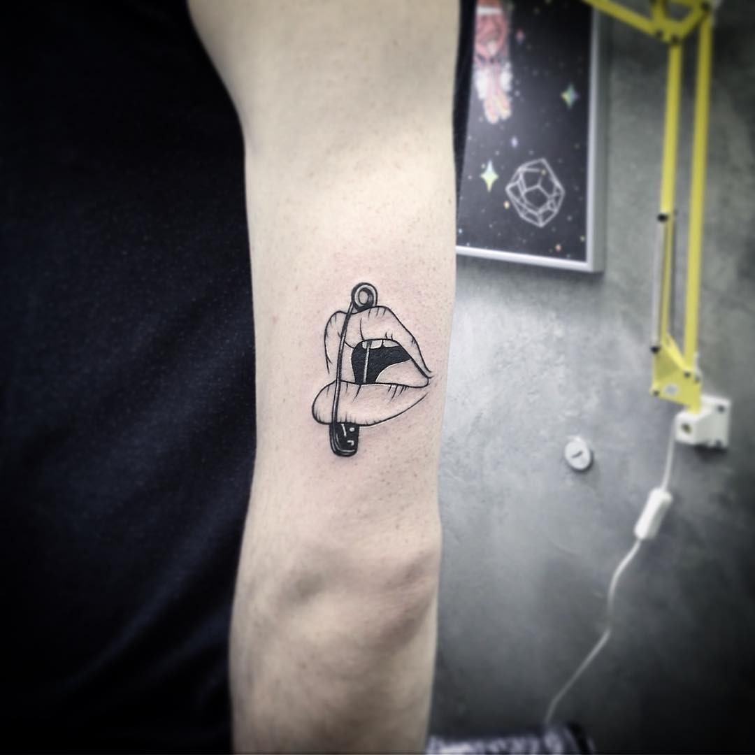 Bold Lips Tattoo with Intriguing Safety Pin Tattoo Design