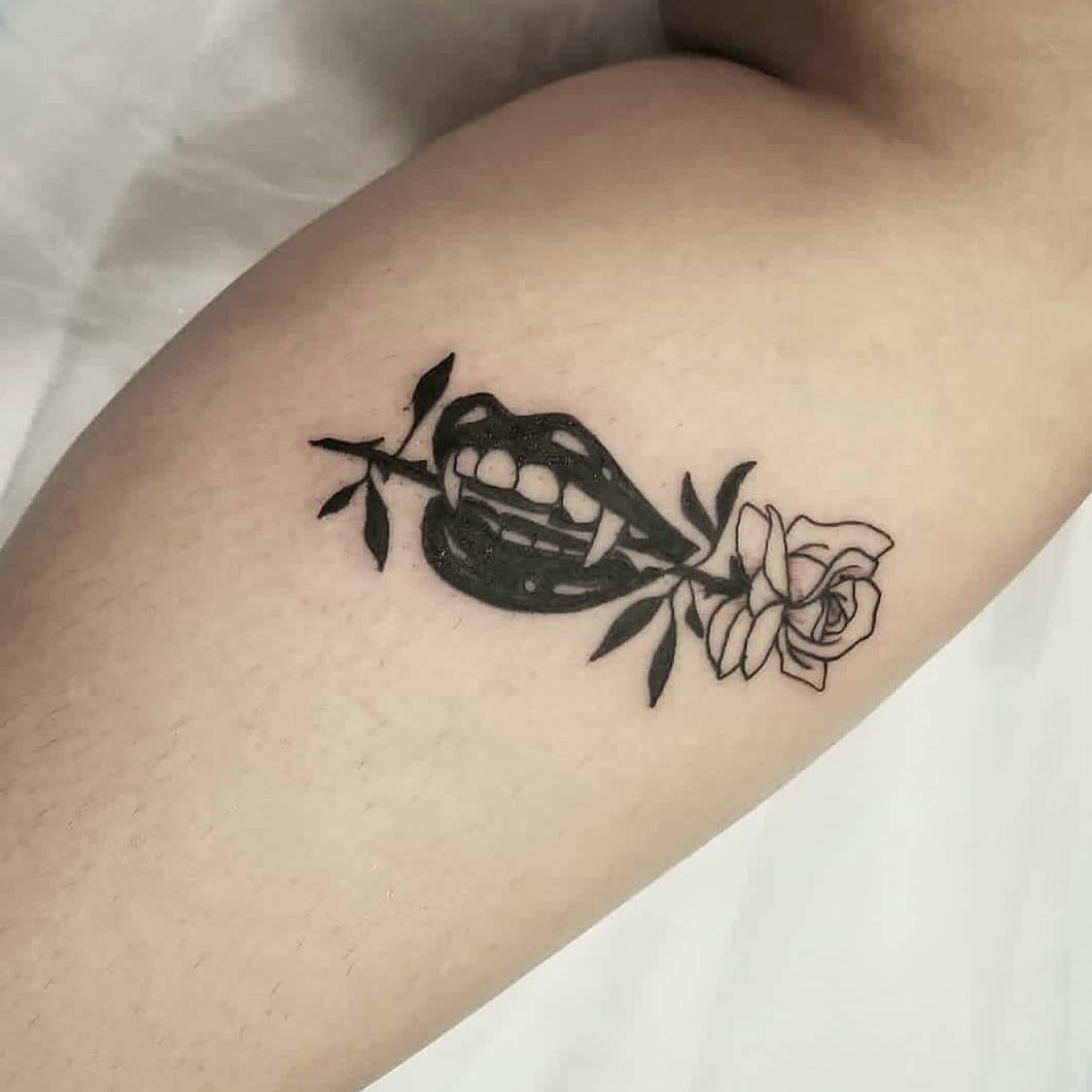 Bold lips with floral elegance in tattoo art Tattoo Design