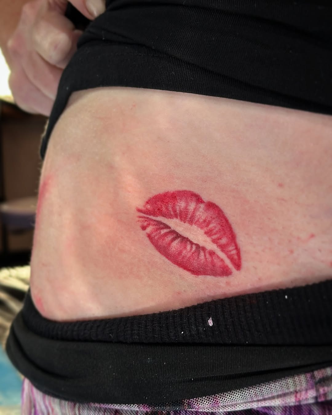 Seductive lip tattoo adds playful vibe Tattoo Design