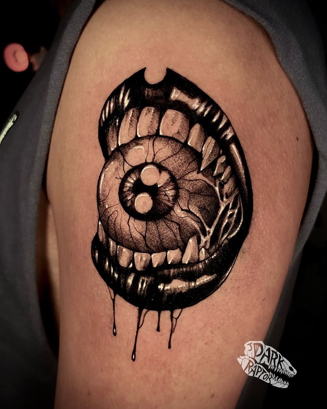 Striking eye within a mouth tattoo design Tattoo Design