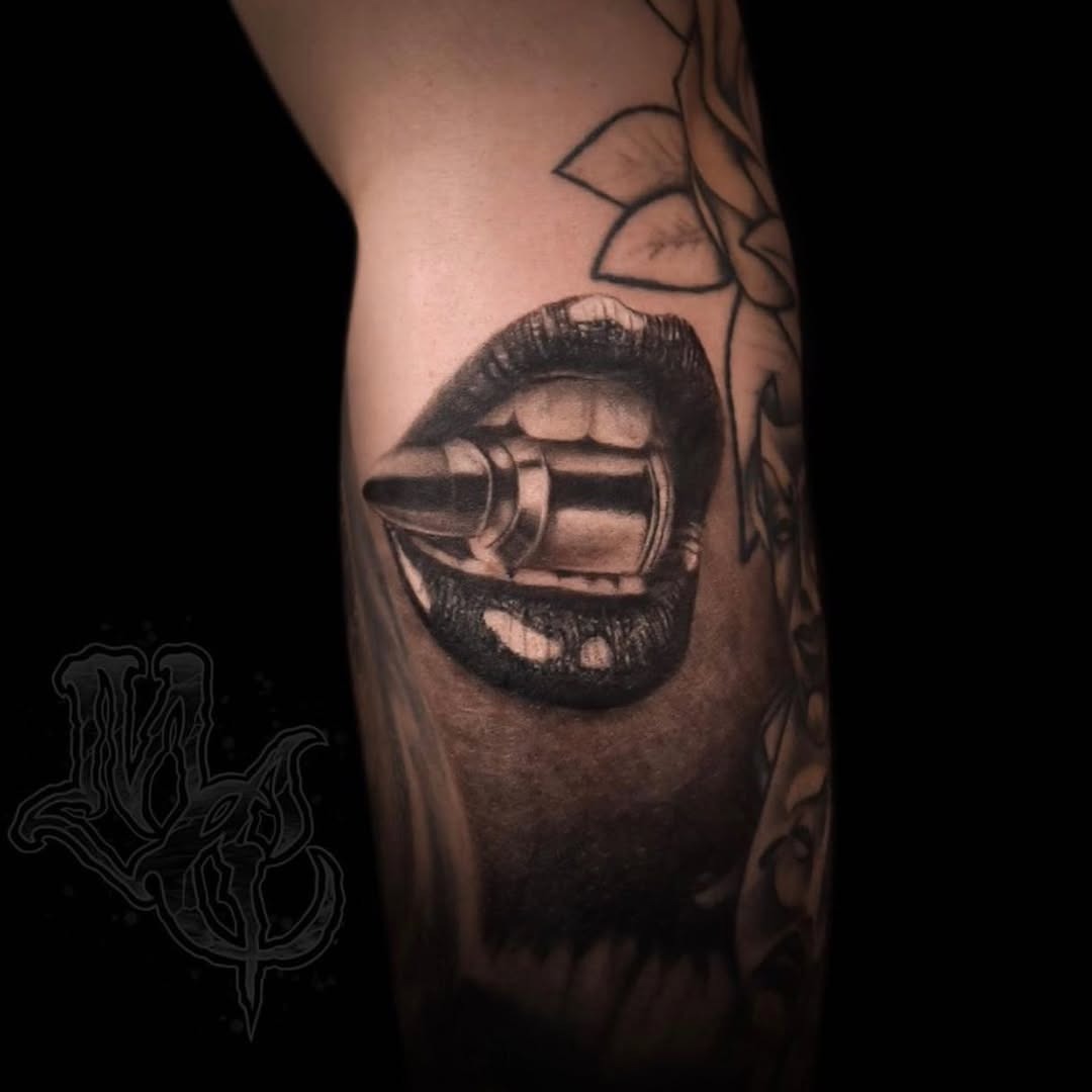 Striking Lips Tattoo with Bullet Detail Tattoo Design