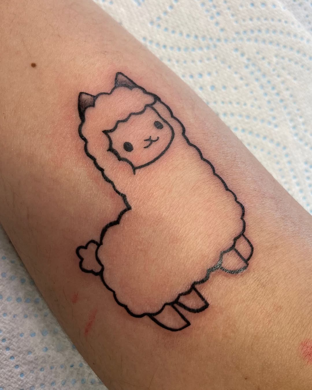 Adorable cartoon llama tattoo for playful vibes Tattoo Design