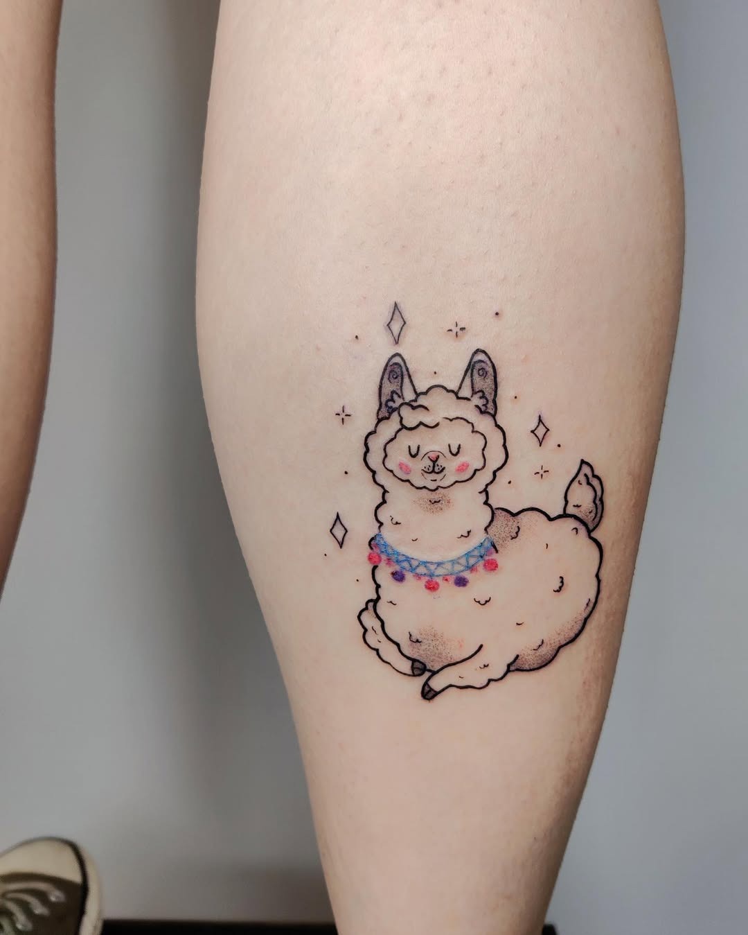 Charming colorful llama tattoo on calf Tattoo Design