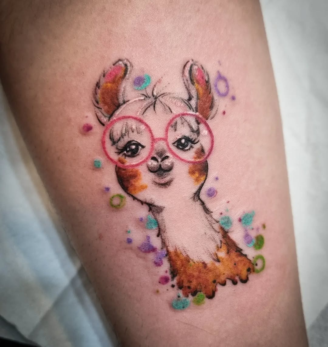 Charming llama tattoo with playful glasses Tattoo Design