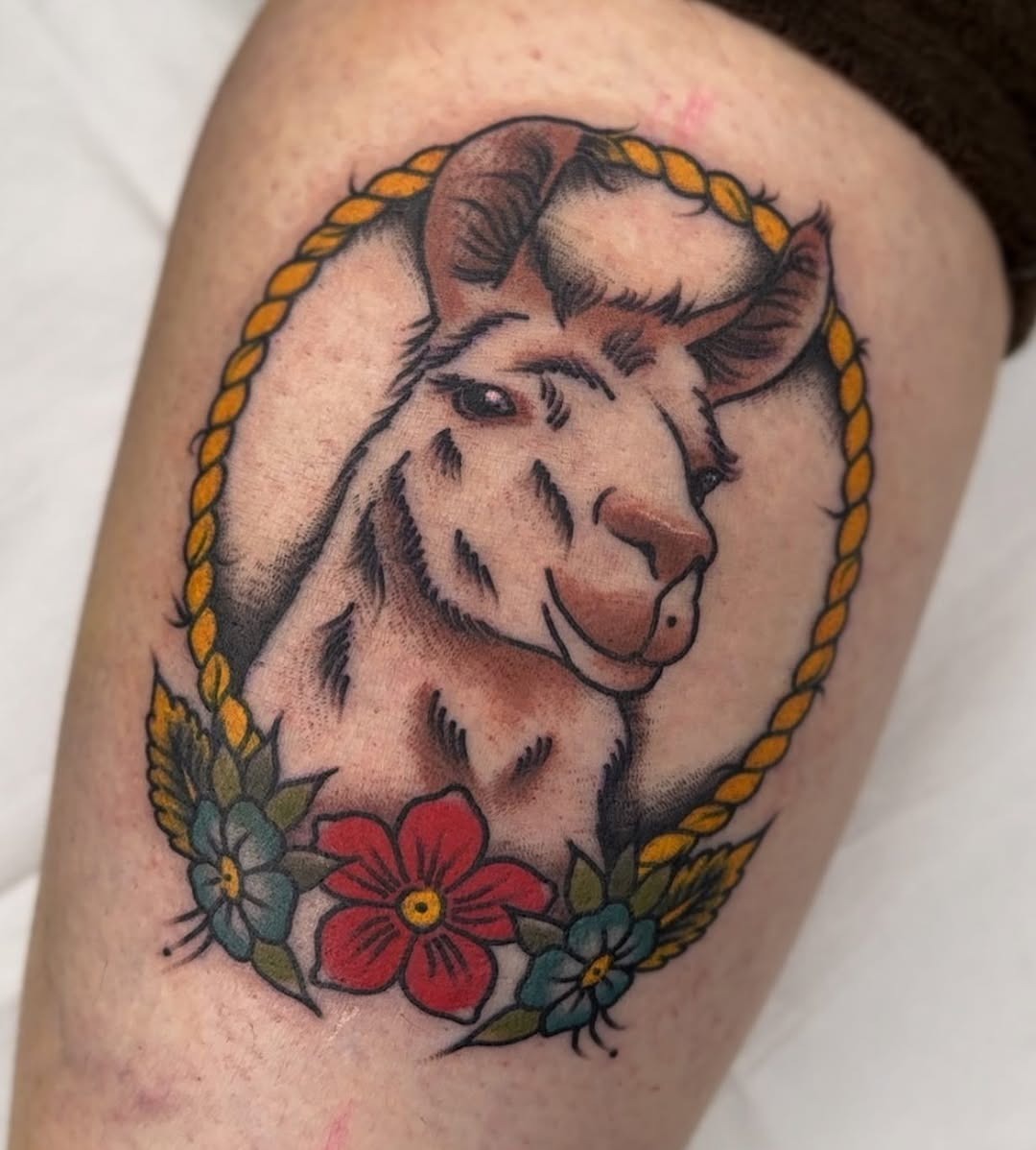 Colorful llama tattoo with floral accents Tattoo Design