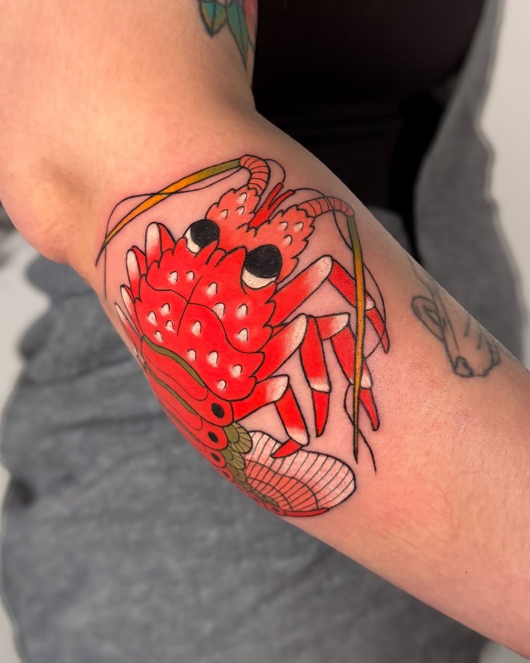 Bold lobster tattoo showcasing vivid red colors Tattoo Design