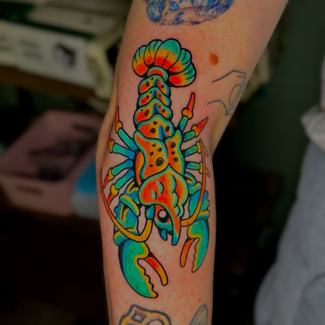 Colorful lobster tattoo bursting with vibrant hues Tattoo Design