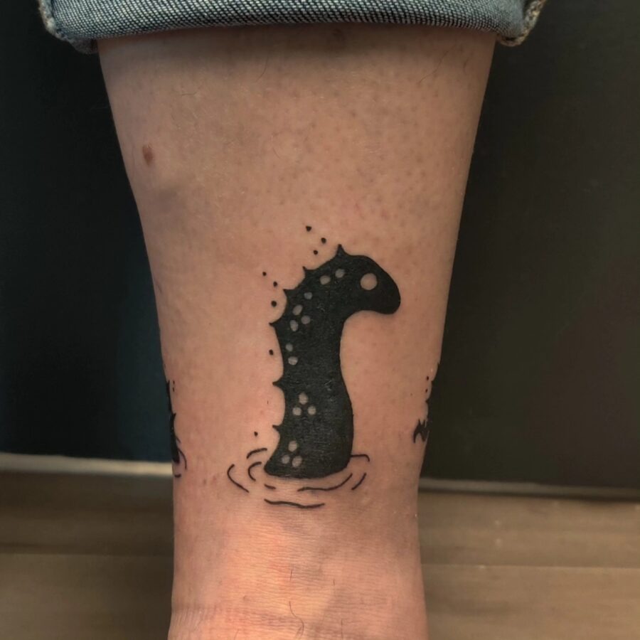 Charming Loch Ness Monster Tattoo on Ankle Tattoo Design