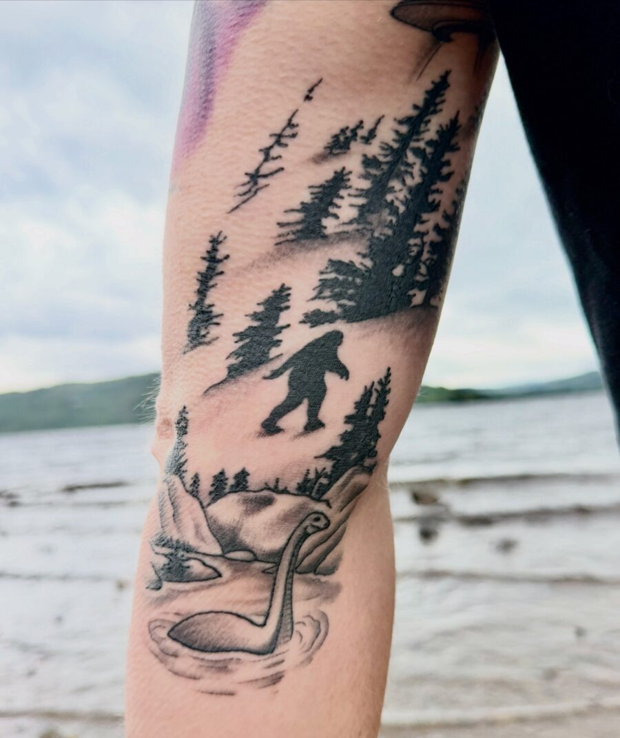 Intricate Loch Ness Monster Tattoo with Forest Scene Tattoo Design