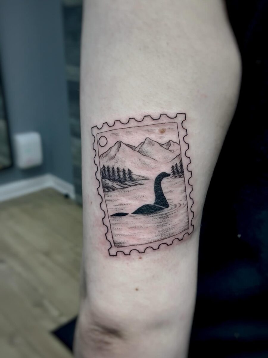 Unique Loch Ness Tattoo in a Stamp Design Tattoo Design