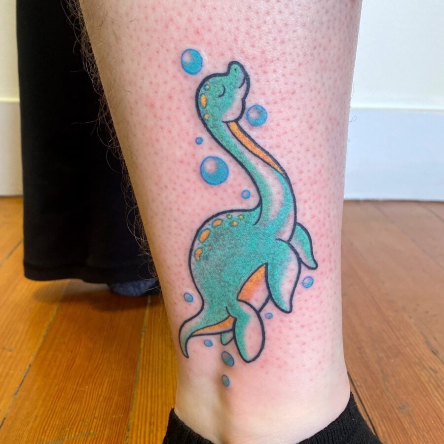 Vibrant Loch Ness Monster Tattoo for Adventure Seekers Tattoo Design