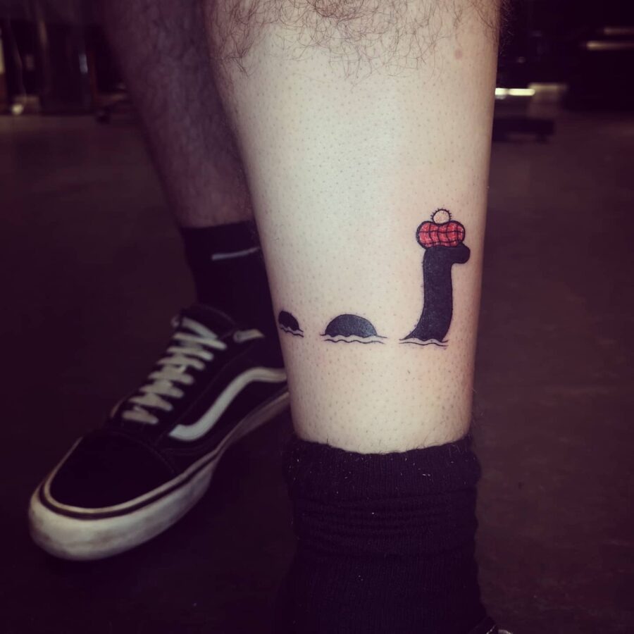 Whimsical Loch Ness Monster Tattoo with a Twist Tattoo Design